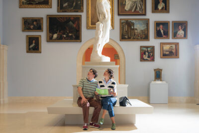 mother and sun sitting in the gallery of Santa Barbara Museum of Art